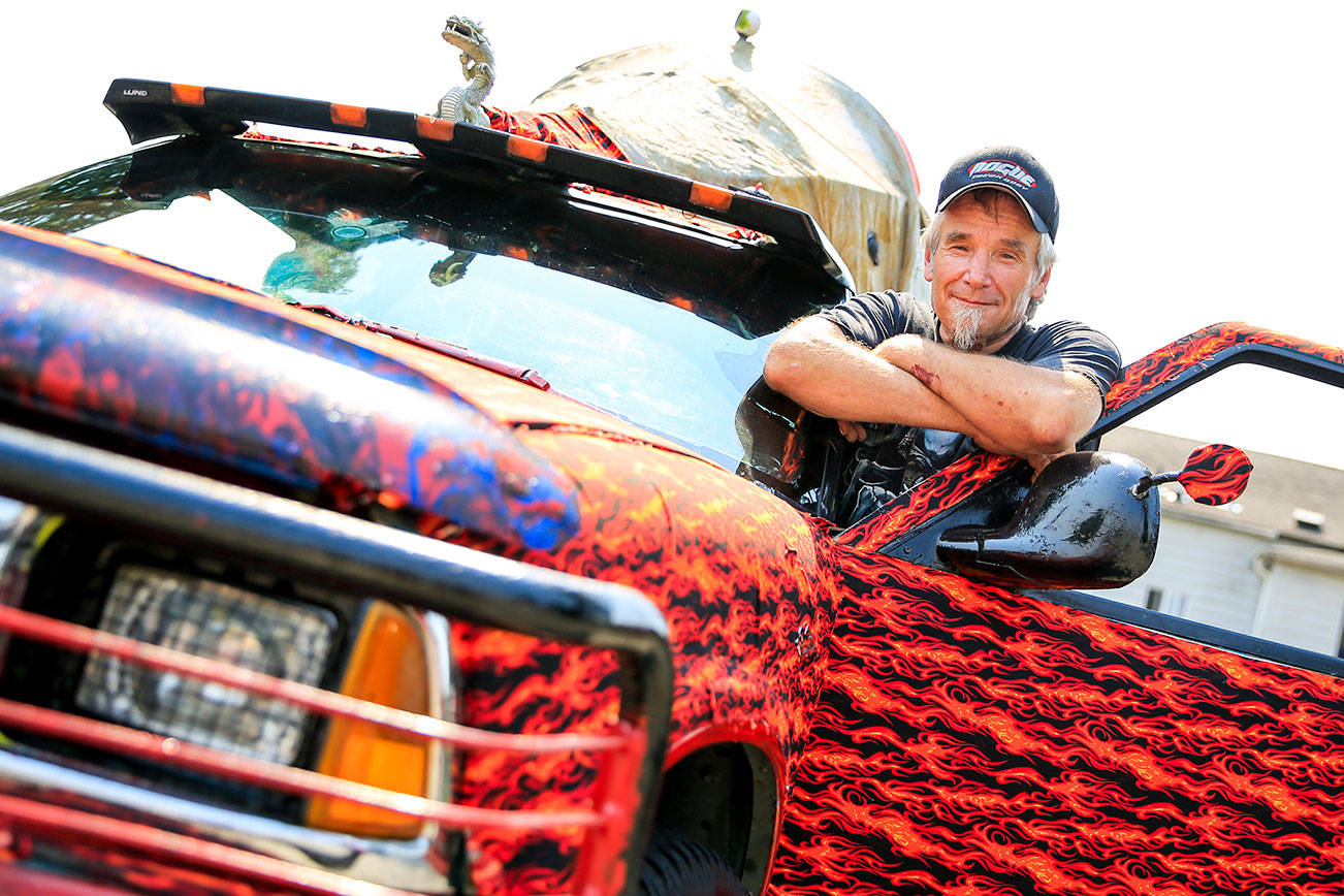 Russell Struck, 63, started decorating his Chevy L5 about five years ago and never stopped and lives in his truck part-time. (Kevin Clark / The Herald)