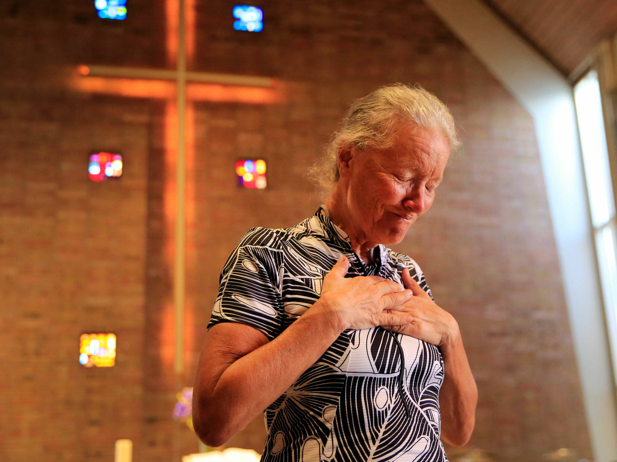 Lynn Salvo reacts to receiving her brother’s wedding ring Tuesday at the Everett United Church of Christ. Her brother died in Vietnam. (Kevin Clark / The Herald)