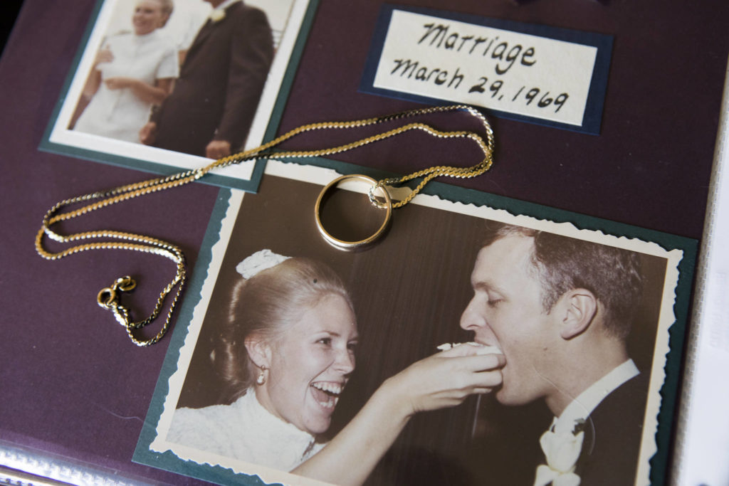 John West’s wedding band and a photograph of Donna and John West on their wedding day. (Olivia Vanni / The Herald) 
