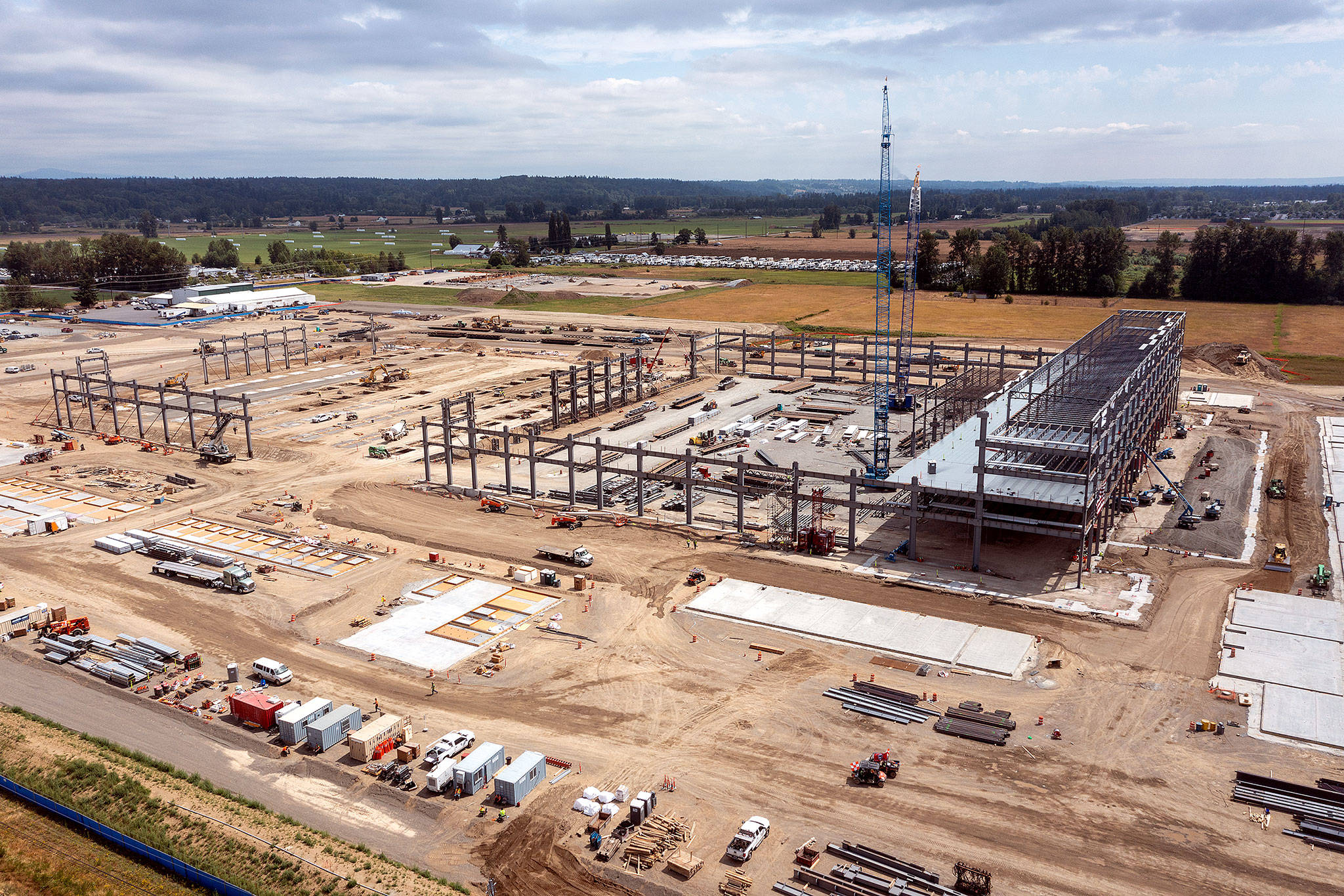 The new Amazon fulfillment center under construction along 172nd Street NE in Arlington, just south of Arlington Municipal Airport, as it looked in July. (Chuck Taylor / Herald file)