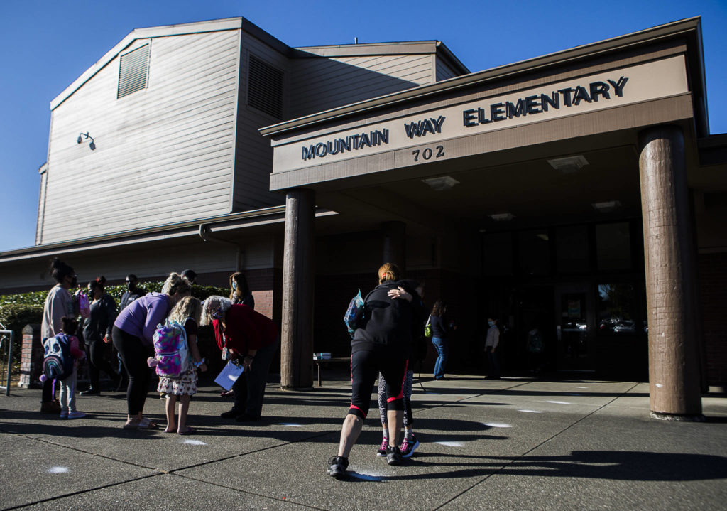 Parents drop their children off at Mountain Way Elementary for the first day of school on Wednesday in Granite Falls. (Olivia Vanni / The Herald)
