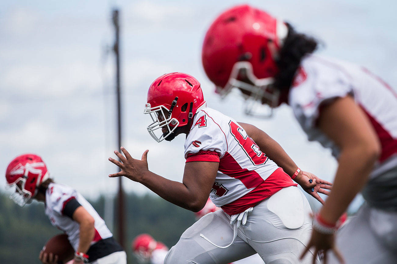 Marysville-Pilchuck’s Josiah Frank warms up during football practice on Thursday, Aug. 19, 2021 in Marysville, Wash. (Olivia Vanni / The Herald)