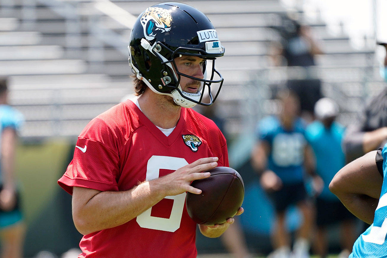 Jacksonville Jaguars quarterback Jake Luton performs a drill during an NFL football team practice, Thursday, May 27, 2021, in Jacksonville, Fla. (AP Photo/John Raoux)