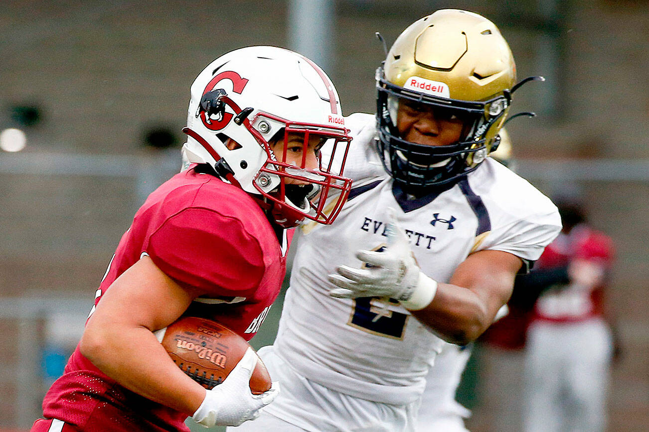 The annual Battle of Broadway between Everett High and Cascade High at Everett Memorial Stadium Friday night on March 19, 2021. (Kevin Clark / The Herald)