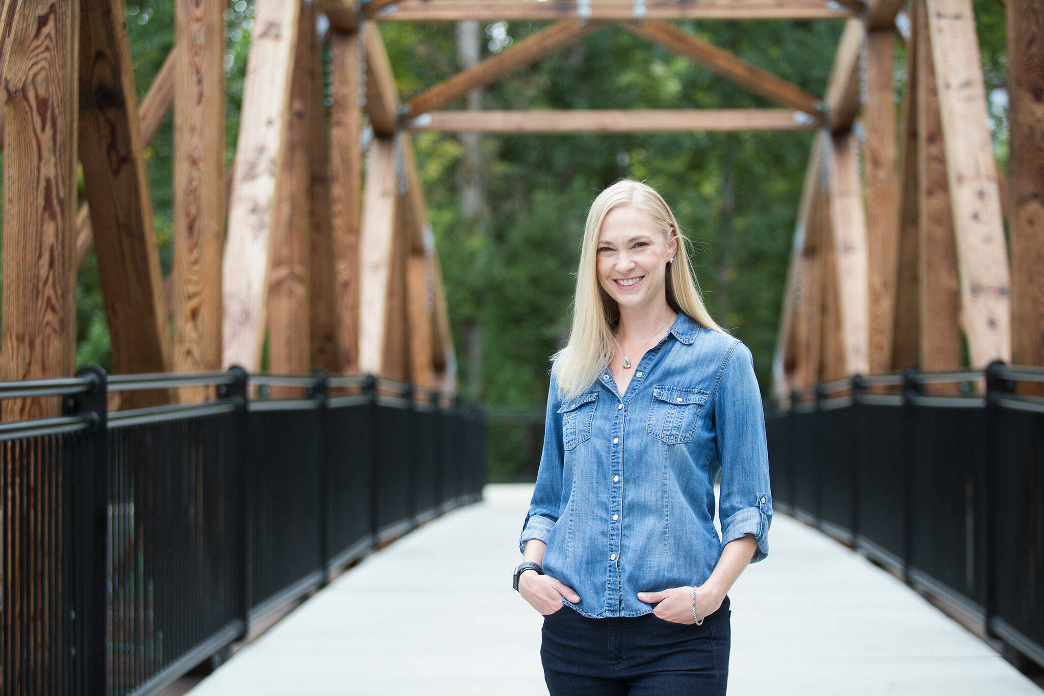 Writer Amanda Johnson, seen here Monday at the The Park at Bothell Landing, has just published her first book, “East of Manhattan.” (Andy Bronson / The Herald)