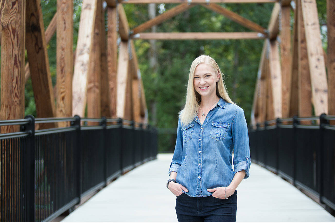 Writer Amanda Johnson at the The Park at Bothell Landing  on Monday, Sept. 6, 2021 in Bothell, Washington.  Johnson has just published her first book, "East of Manhattan" .(Andy Bronson / The Herald)