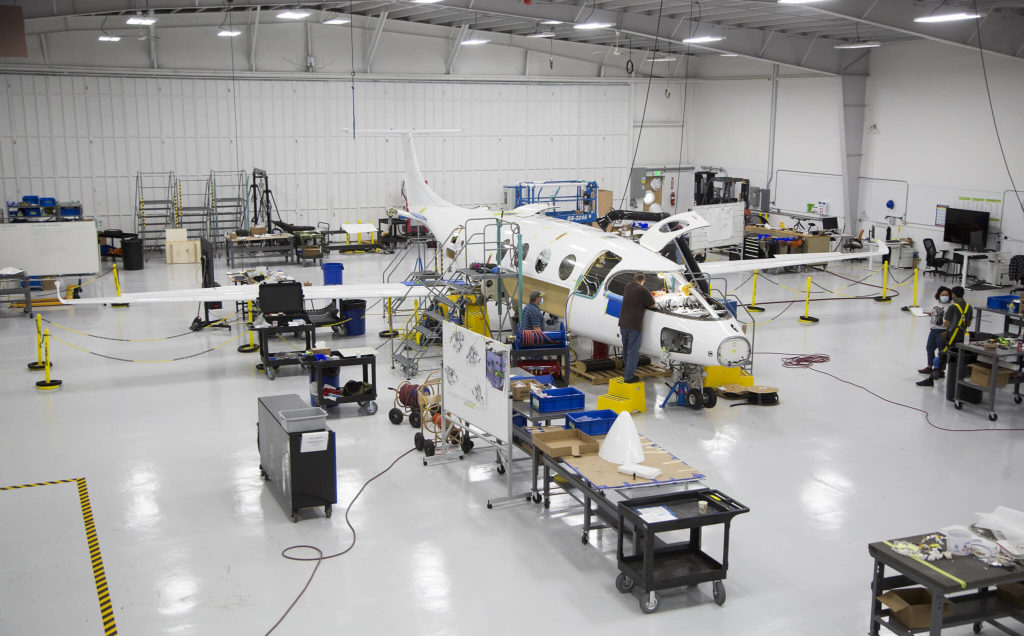 Workers build the first all-electric commuter plane, the Eviation Alice, on Sept. 8 in Arlington. The plane is designed for regional travel and to carry nine passengers. (Andy Bronson / The Herald)
