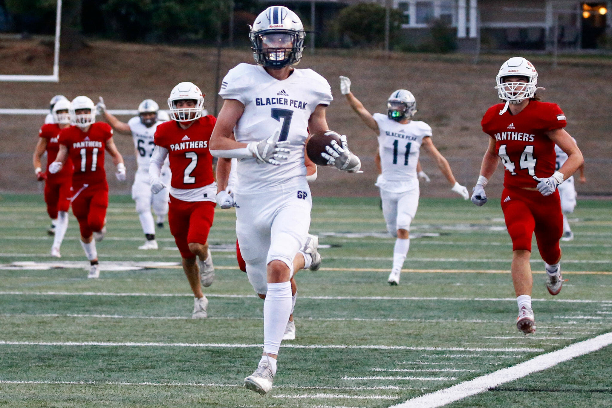 Glacier Peak’s Logan Szarzec outruns the Snohomish defense for a touchdown during the second quarter Friday night at Veteran’s Memorial Stadium in Snohomish. (Kevin Clark / The Herald)