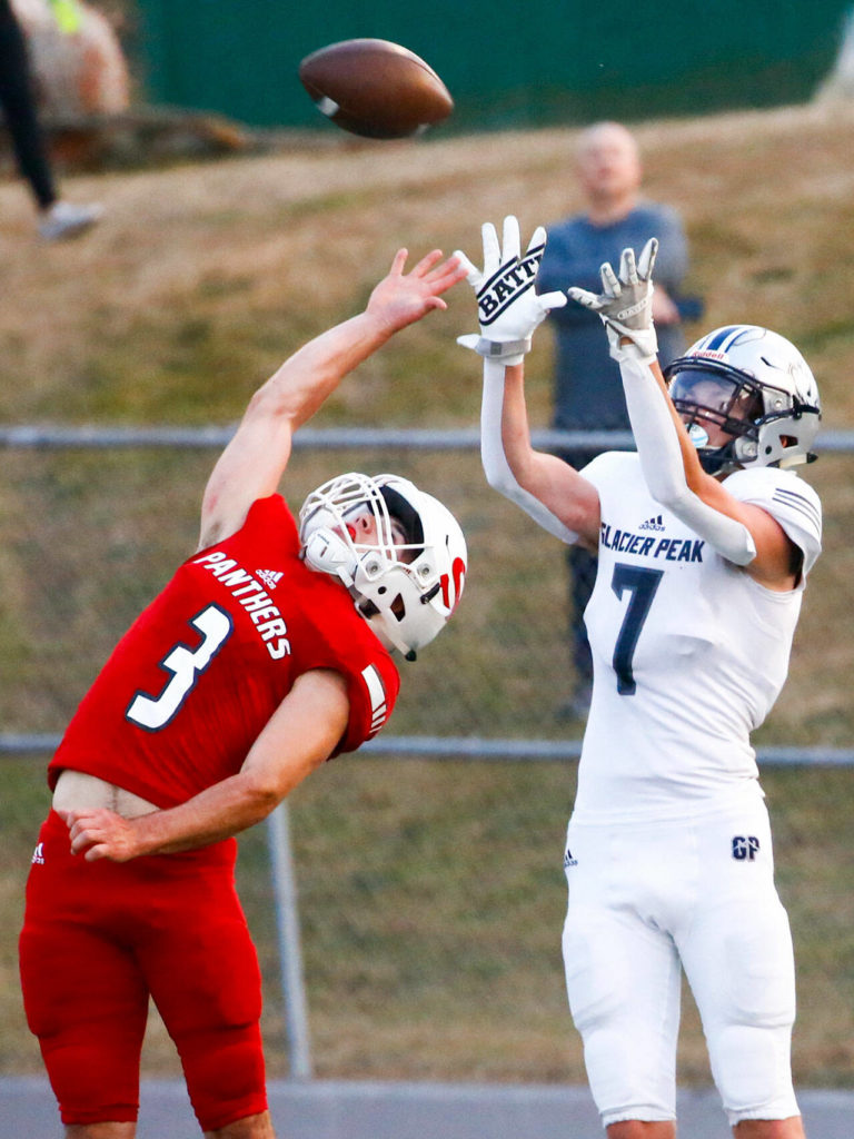Snohomish’s Joshua Vandergriend makes a defensive play on a pass intended for Glacier Peak’s Logan Szarzec Friday night at Veteran’s Memorial Stadium in Snohomish September 3, 2021. (Kevin Clark / The Herald)
