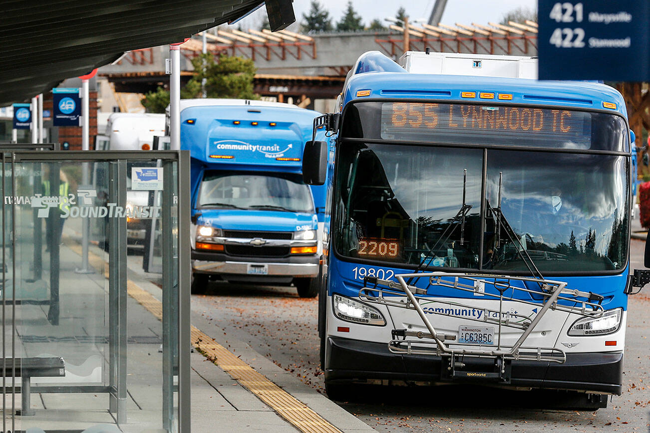 Community Transit is preparing to shift commuter buses that go to the University of Washington in Seattle to connect with Link light rail in Northgate next year. (Kevin Clark / The Herald)
