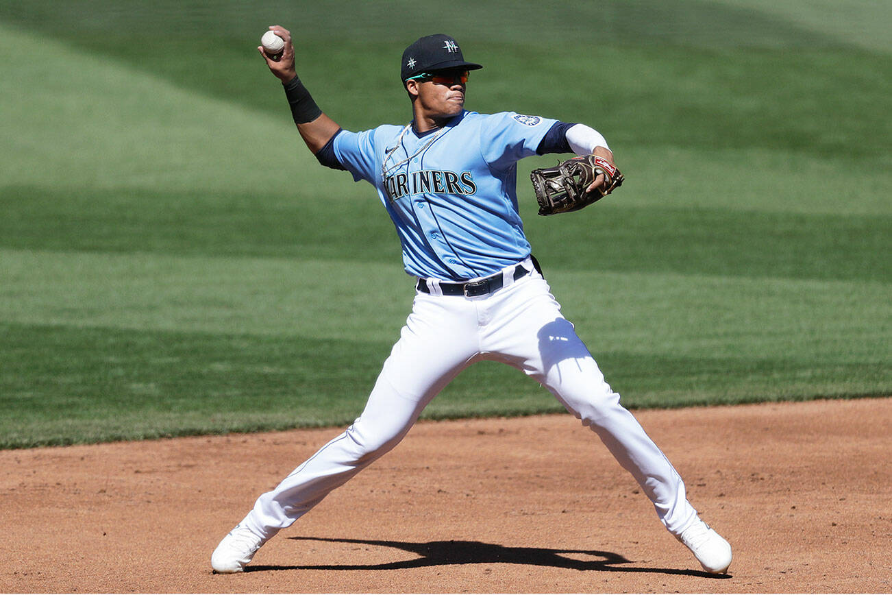 Seattle Mariners shortstop Noelvi Marte throws to first during an intrasquad baseball game Tuesday, July 14, 2020, in Seattle. (AP Photo/Elaine Thompson)