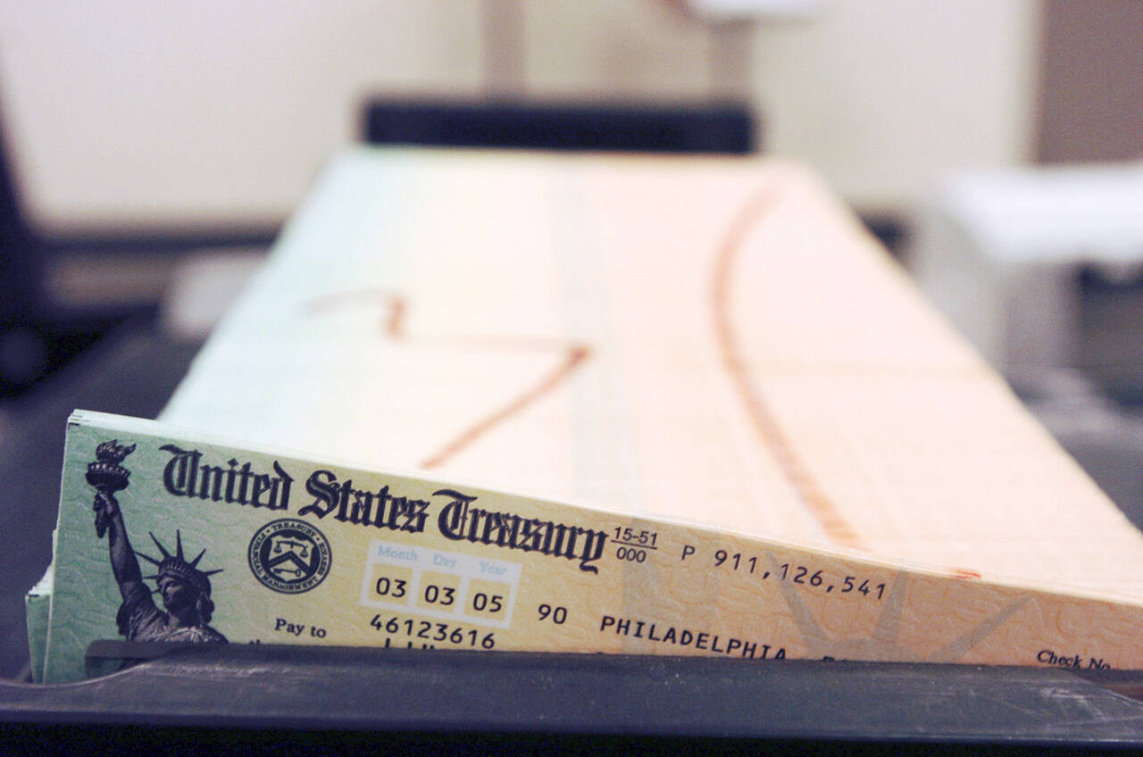 Trays of Social Security checks wait to be mailed from the U.S. Treasury’s Financial Management services facility in Philadelphia in 2005. A new report found that Social Security’s trust funds could be depleted by 2033 without action by Congress. (Bradley C. Bower / Associated Press file photo)