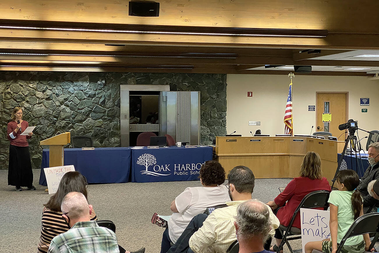 Several audience members refused to wear a mask or leave the building after Oak Harbor School Board President John Diamond asked them to comply with Gov. Inslee’s indoor mask mandate during the Aug. 30 meeting. (Jason Uemoto, file)