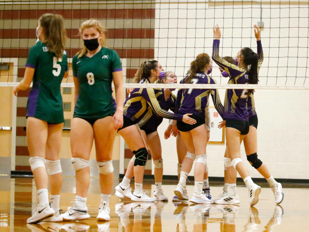 Lake Stevens’ celebrate a point against Edmonds-Woodway Tuesday night at Edmonds-Woodway High School in Edmonds on September 7, 2021. The Vikings won in straight sets. (Kevin Clark / The Herald)

