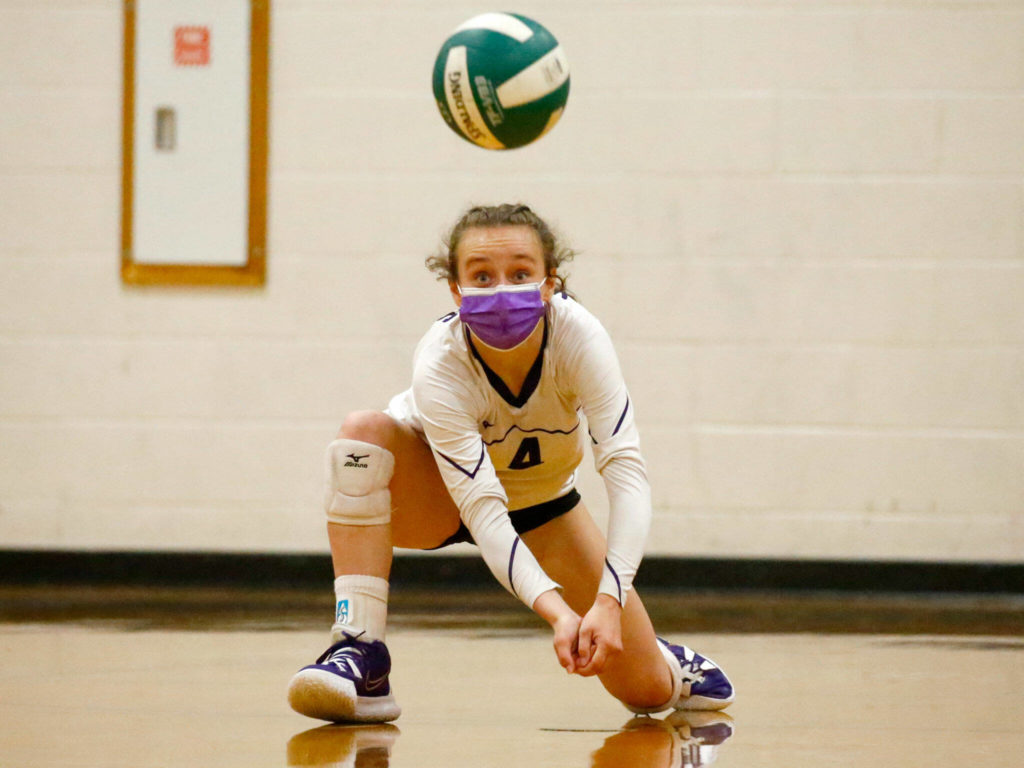 Lake Stevens’ Kennedy Steen digs against Lake Stevens’ Tuesday night at Edmonds-Woodway High School in Edmonds on September 7, 2021. The Vikings won in straight sets. (Kevin Clark / The Herald)
