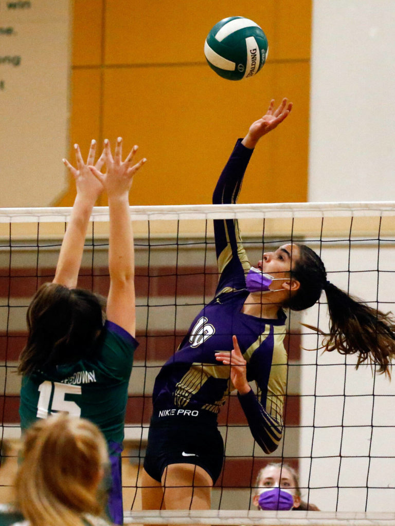 Lake Stevens’ Hayli Tri attempts a spike over Edmonds-Woodway’s Gretchen Lewis Tuesday night at Edmonds-Woodway High School in Edmonds on September 7, 2021. The Vikings won in straight sets. (Kevin Clark / The Herald)
