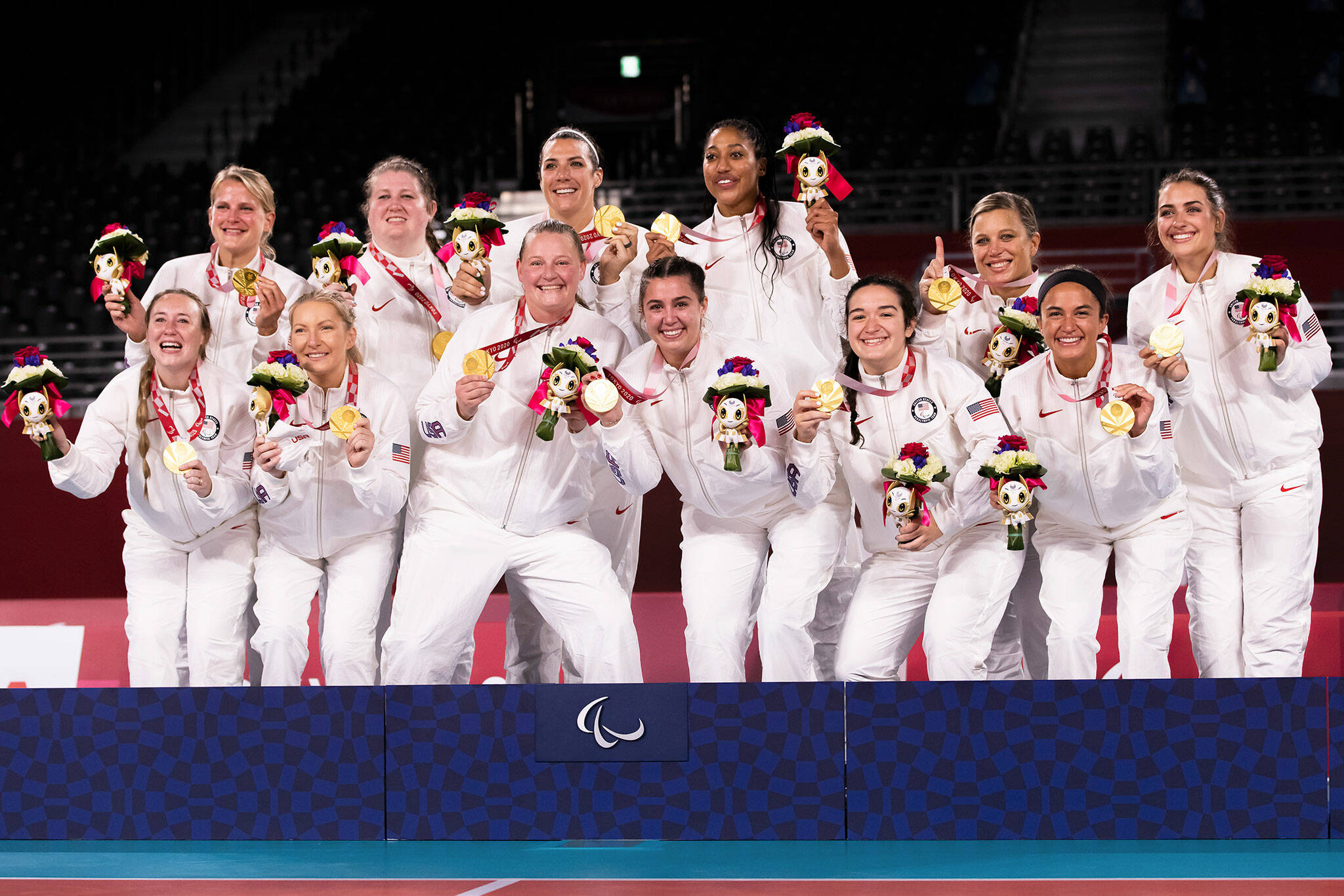Lake Stevens High School graduate Katie Holloway (top row, third from left) and the rest of the United States women’s sitting volleyball team celebrate with their gold medals after defeating China in the final match at the 2020 Paralympic Games on Sept. 5, 2021, in Tokyo. (Photo provided by USA Volleyball)