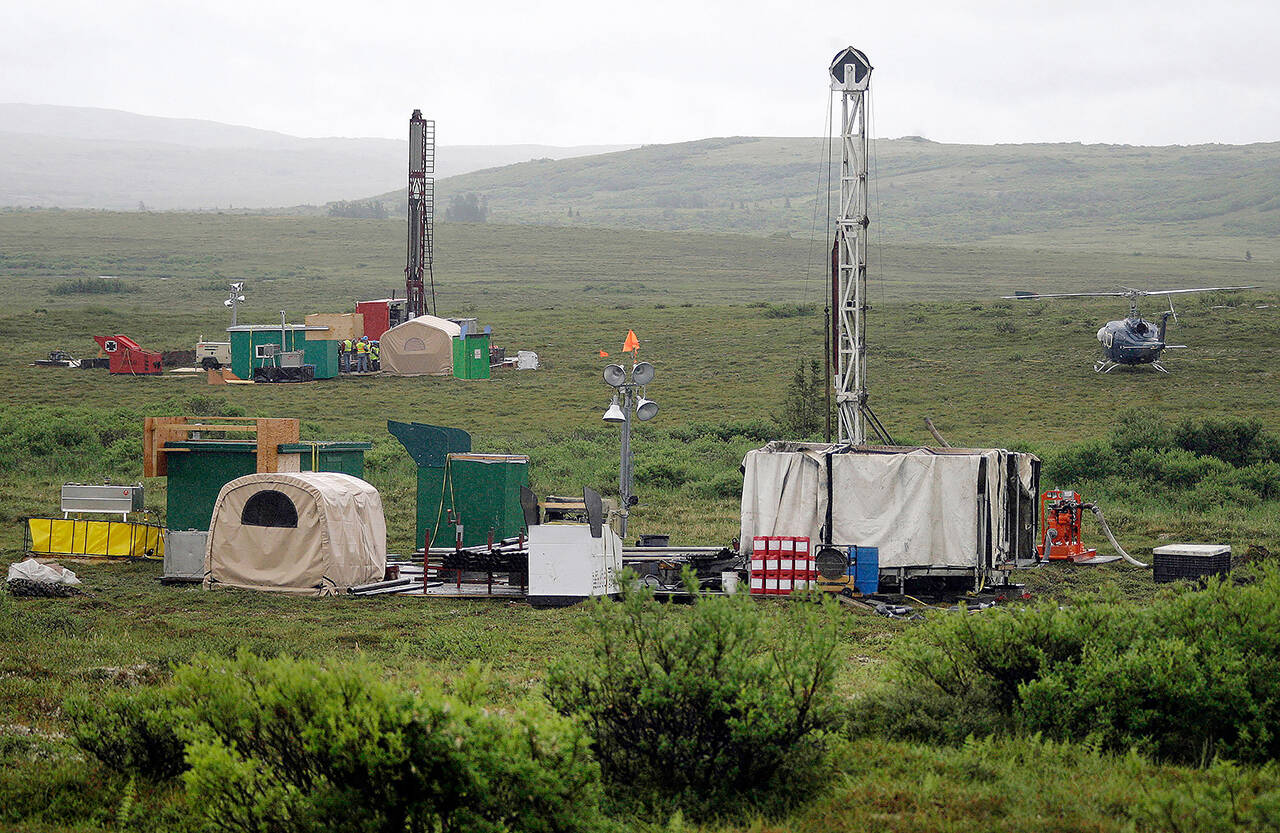 In this 2007 photo, workers with the Pebble Mine project test drill in the Bristol Bay region of Alaska, near the village of Iliamma. (AP Photo/Al Grillo, File)