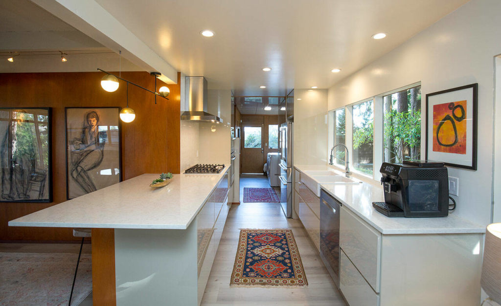 The kitchen was renovated so that it feels as open as the other rooms in the house. (Andy Bronson / The Herald)
