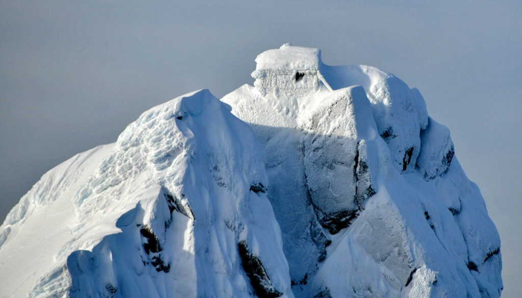 An aerial photo of Three Fingers Lookout in winter shows a damaged window and shutter. (Long Bach Nguyen)
