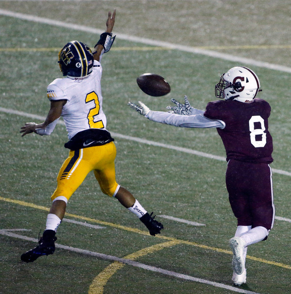 Cascade’s Lyle Pinaula makes a reception over Mariners’ Macky James for touchdown Friday evening at Everett Memorial Stadium on September 10, 2021. (Kevin Clark / The Herald)
