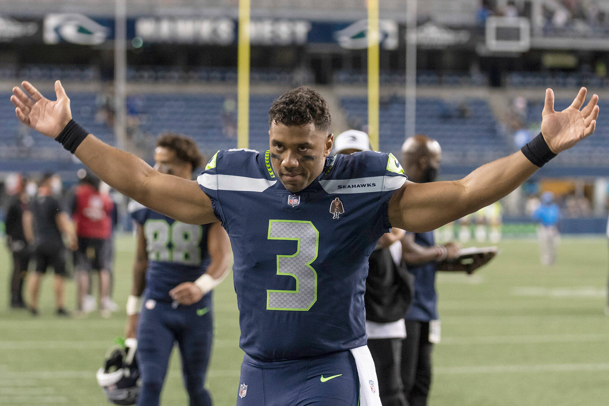 Seahawks quarterback Russell Wilson gestures as he walks off the field after a preseason game against the Chargers on Aug. 28, 2021, in Seattle. (AP Photo/Stephen Brashear)
