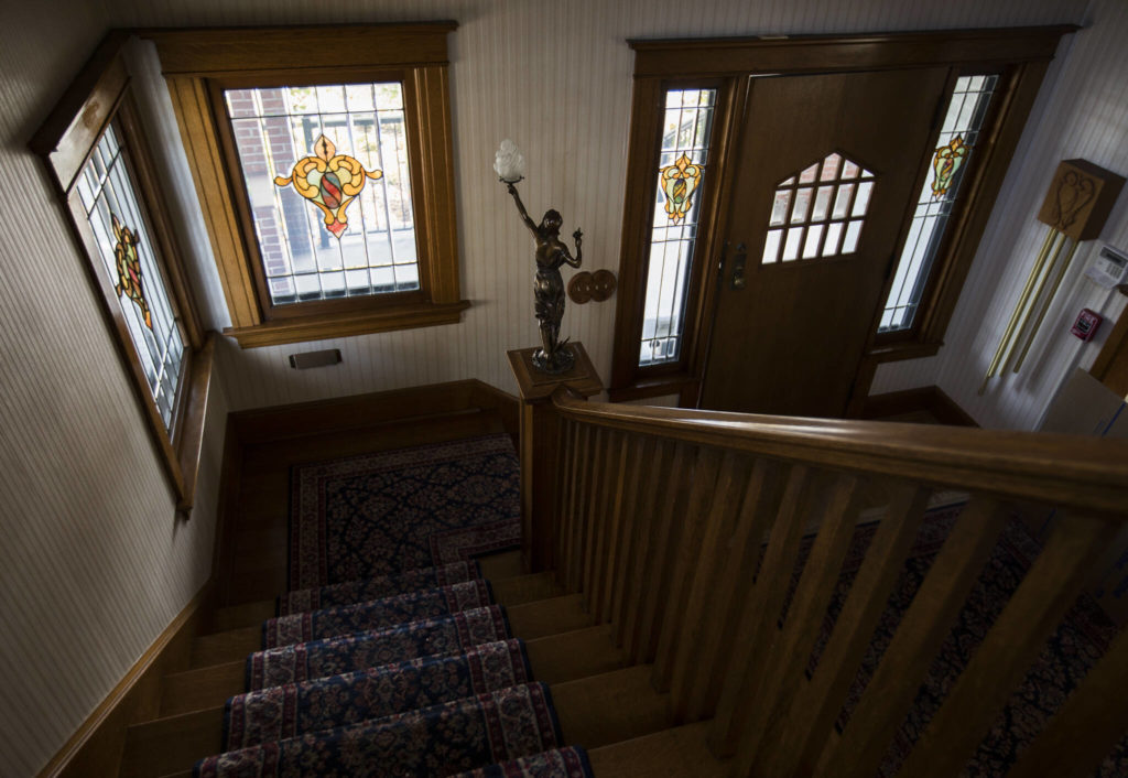 A bronze fixture stands on the end of the banister leading up to the second floor of the Van Valey House on Wednesday in Everett. (Olivia Vanni / The Herald)
