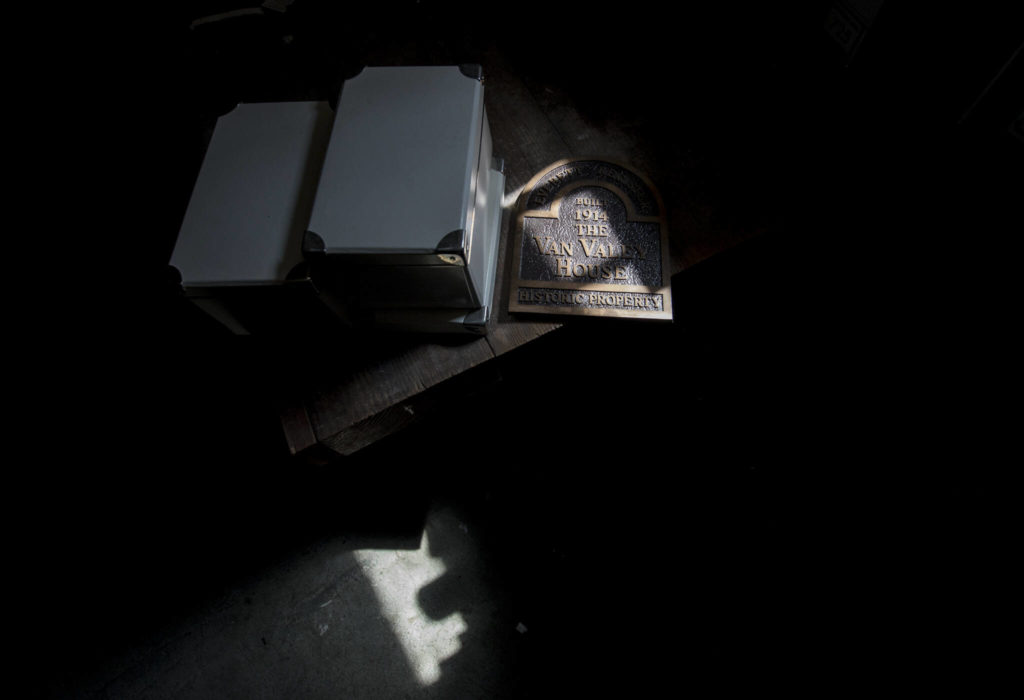 A historic property plate sits in the basement of the Van Valey House on Wednesday in Everett. (Olivia Vanni / The Herald)
