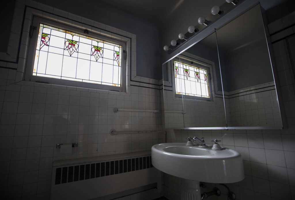 Stained glass panels inside the second-floor bathroom of the Van Valey House on Wednesday in Everett. (Olivia Vanni / The Herald)
