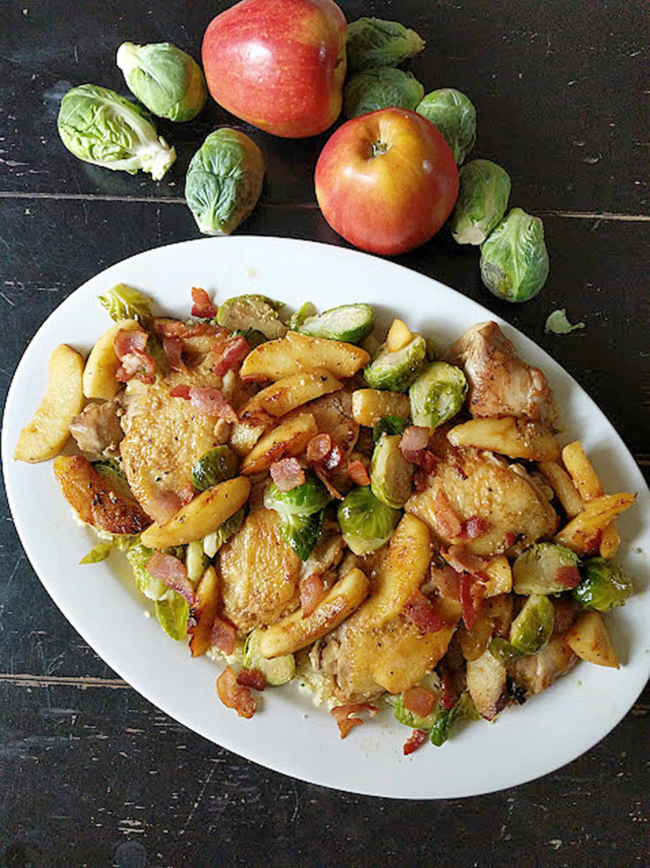 Chicken thighs braised in hard cider with Brussels sprouts and apples makes an easy one-pan fall dinner. (Gretchen McKay / Pittsburgh Post-Gazette)