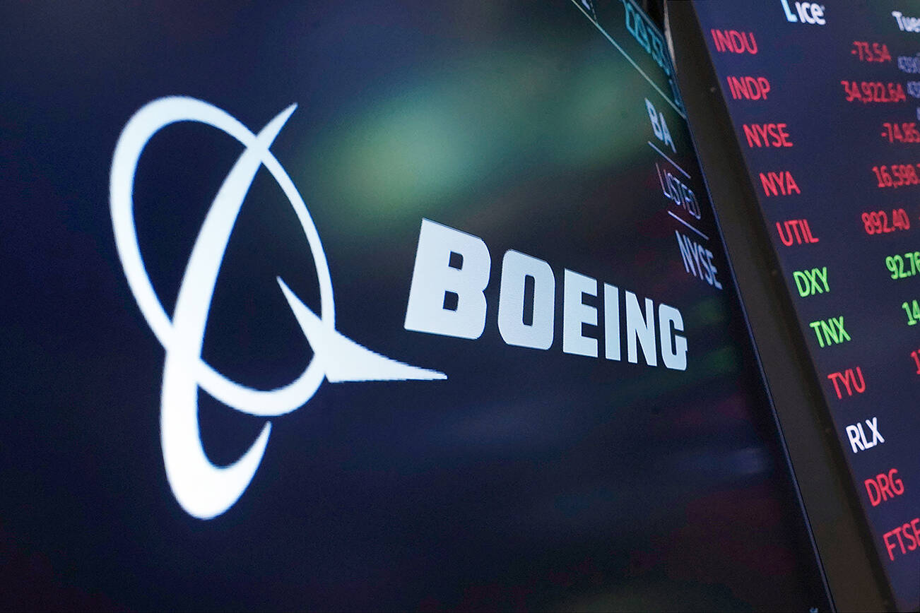 FILE - The logo for Boeing appears on a screen above a trading post on the floor of the New York Stock Exchange, Tuesday, July 13, 2021. Despite the pandemic's damage to air travel, Boeing says it's optimistic about long-term demand for airplanes. Boeing said Tuesday, Sept. 14, 2021 that it expects the aerospace market to be worth $9 trillion over the next decade. That includes planes for airlines and military uses and other aerospace products and services. (AP Photo/Richard Drew, file)