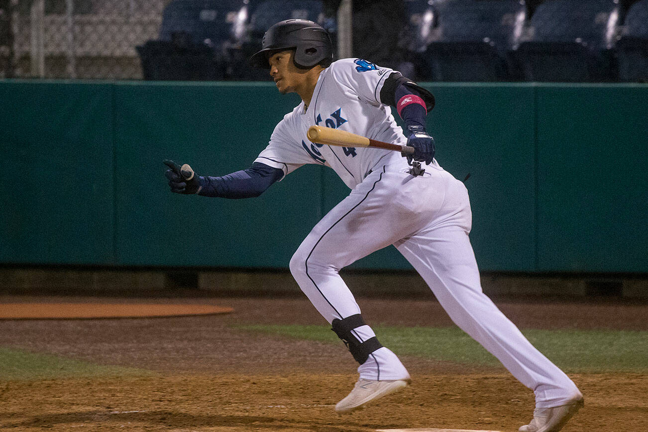 The AquaSox' Noelvi Marte hits a double against the Spokane Indians at Funko Field on Tuesday, Sept. 14, 2021 in Everett, Washington. The Mariners promoted Marte from Low-A Modesto to High-A Everett on Monday. (Andy Bronson / The Herald)