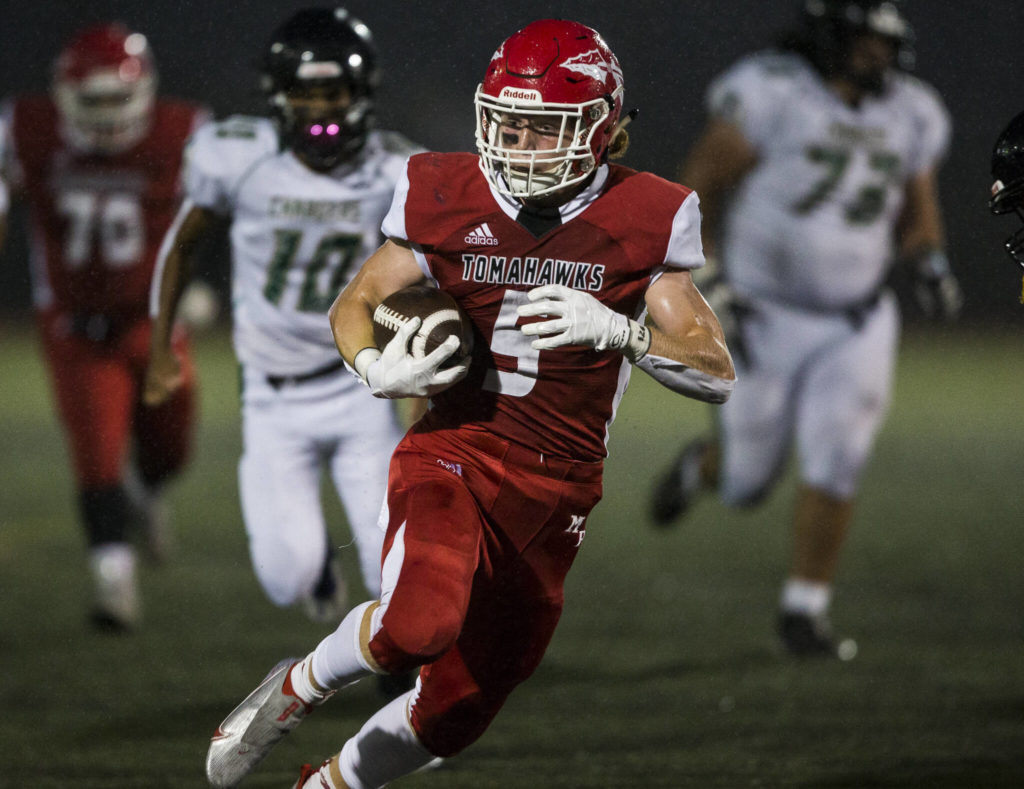 Marysville Pilchuck’s Dylan Carson runs the ball in for a touchdown during the annual Berry Bowl against Marysville Getchell on Friday, Sept. 17, 2021 in Marysville, Wa. (Olivia Vanni / The Herald)
