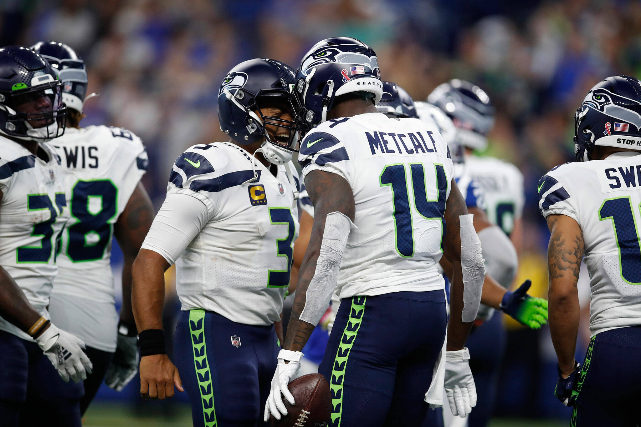 Seahawks quarterback Russell Wilson (3) celebrates with wide receiver DK Metcalf (14) after a touchdown against the Colts on Sept. 12, 2021, in Indianapolis. (Jeff Haynes/AP Images for Panini)