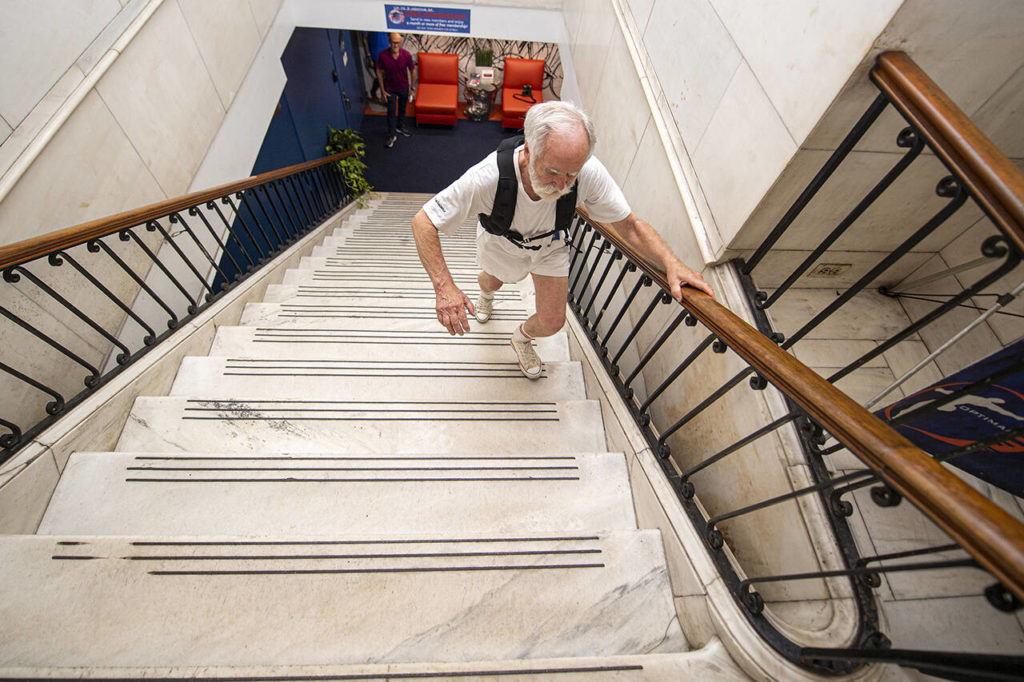 Pallett dons a 15-pound vest and climbs 100 stairs — two at a time — as a warm up. (Jose F. Moreno / The Philadelphia Inquirer)
