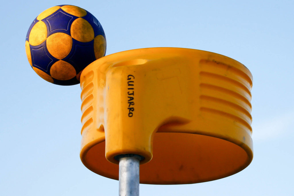 A korfball hits the edge of the basket Sept. 9 at Mukilteo Beach. (Kevin Clark / The Herald)
