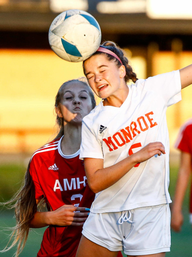 Monroe’s Adrien Dayton heads the ball with Archbishop Murphy’s Cameron Bourne trailing Thursday night at Archbishop Murphy High School in Everett on September 23, 2021. (Kevin Clark / The Herald)
