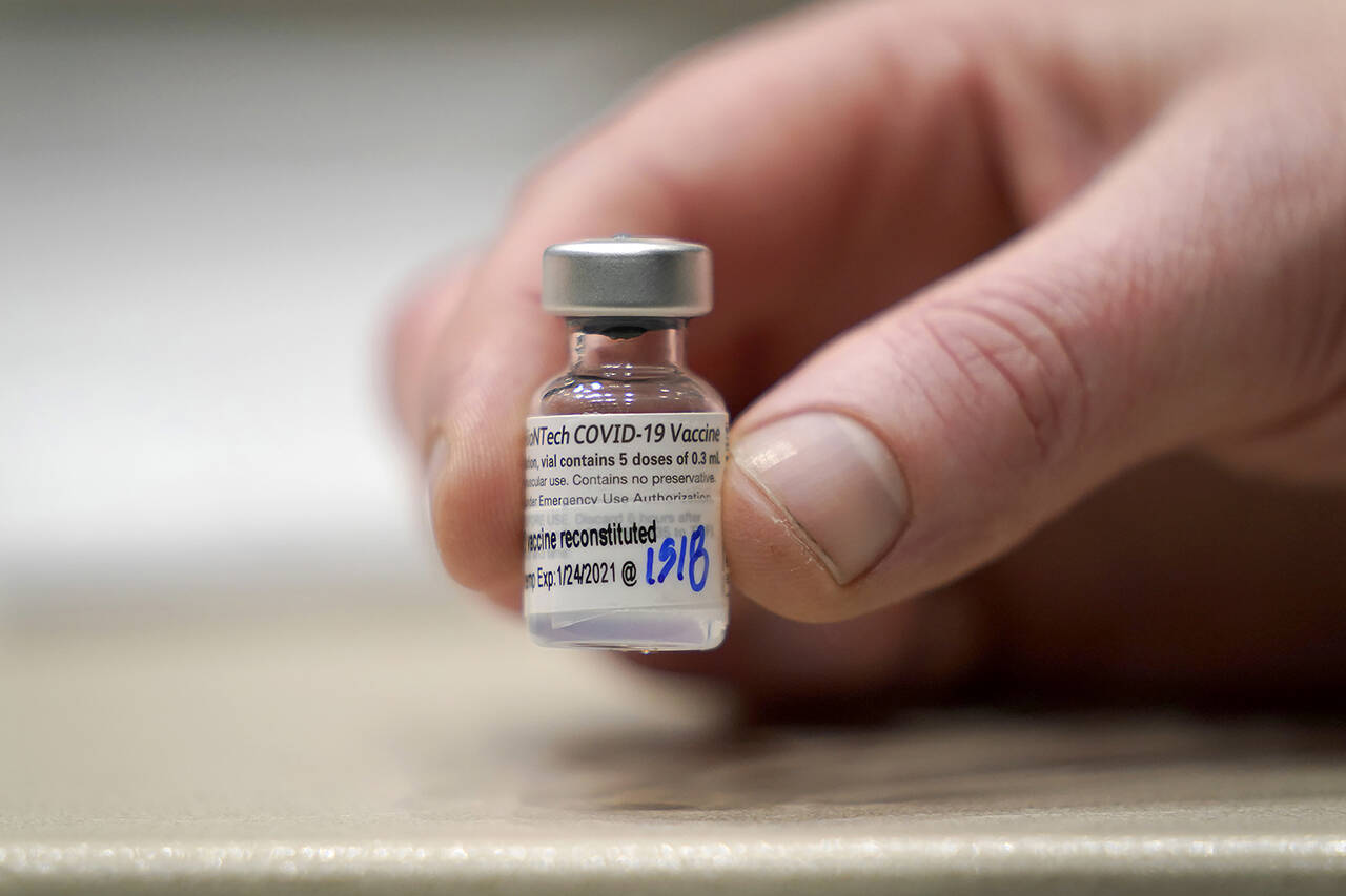 A vial of the Pfizer vaccine for COVID-19 at a one-day vaccination clinic set up in an Amazon.com facility in Seattle. (AP Photo/Ted S. Warren, File)