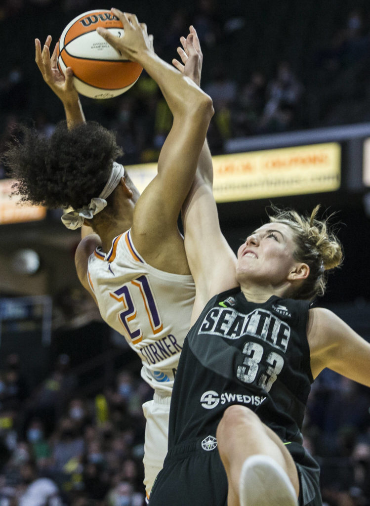Seattle Storm’s Katie Lou Samuelson tries to block a shot by Phoenix’s Brianna Turner during the second-round, single elimination playoff game at Angel of the Winds Arena on Sunday in Everett. (Olivia Vanni / The Herald)
