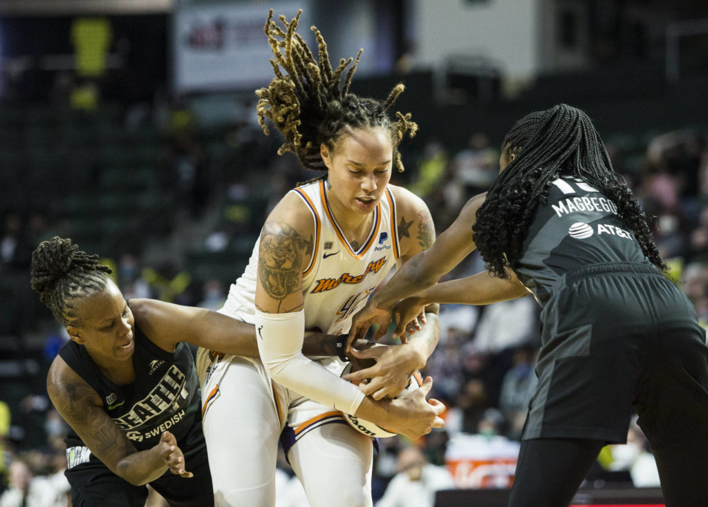 Seattle Storm’s Epiphanny Prince and Ezi Magbegor fight Phoenix’s Brittney Griner for the ball during the second-round, single elimination playoff game at Angel of the Winds Arena on Sunday in Everett. (Olivia Vanni / The Herald)
