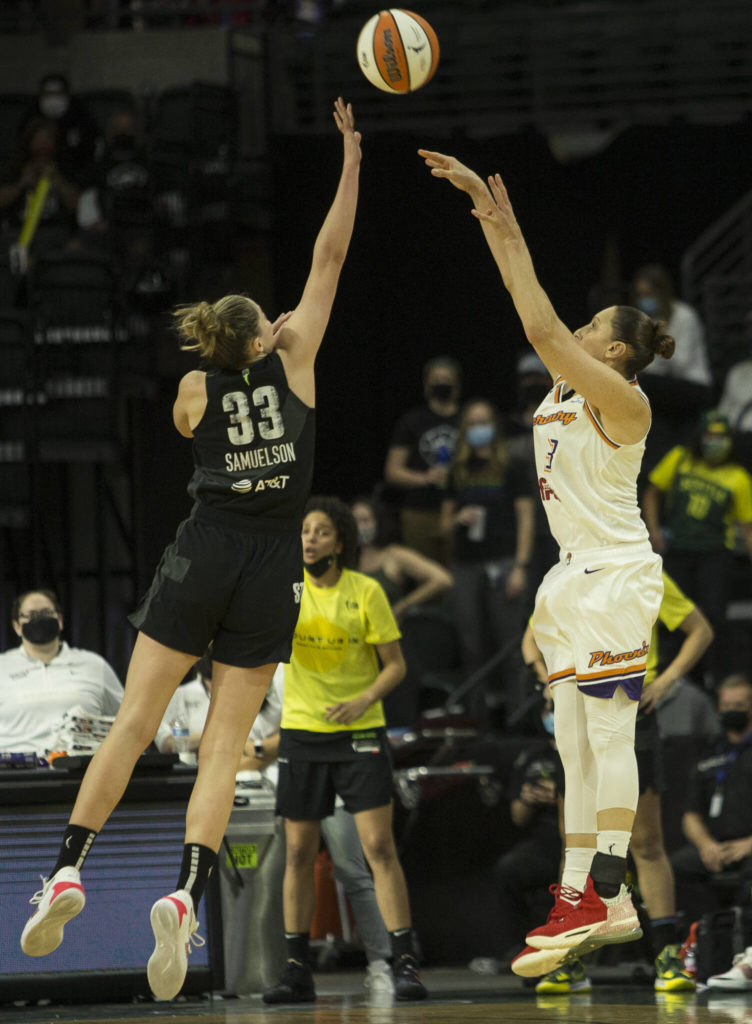 Seattle Storm’s Katie Lou Samuelson jumps to block a 3-point shot by Phoenix’s Diana Taurasi during the second-round, single elimination playoff game at Angel of the Winds Arena on Sunday in Everett. (Olivia Vanni / The Herald)
