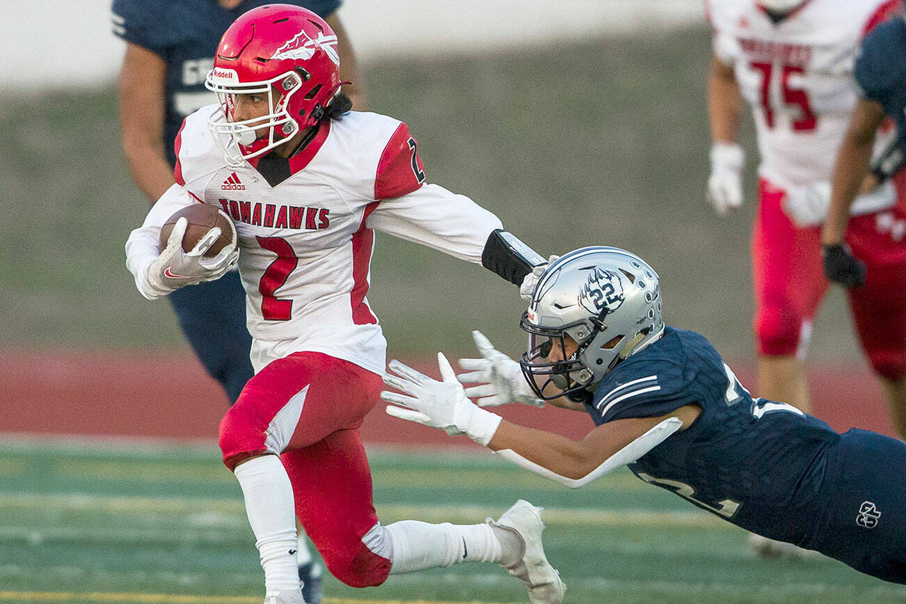 Marysville-Pilchuck's Michael Bejar escapes a tackle during the game against Glacier Peak on Friday, Sept. 24, 2021 in Snohomish, Wa. (Olivia Vanni / The Herald)