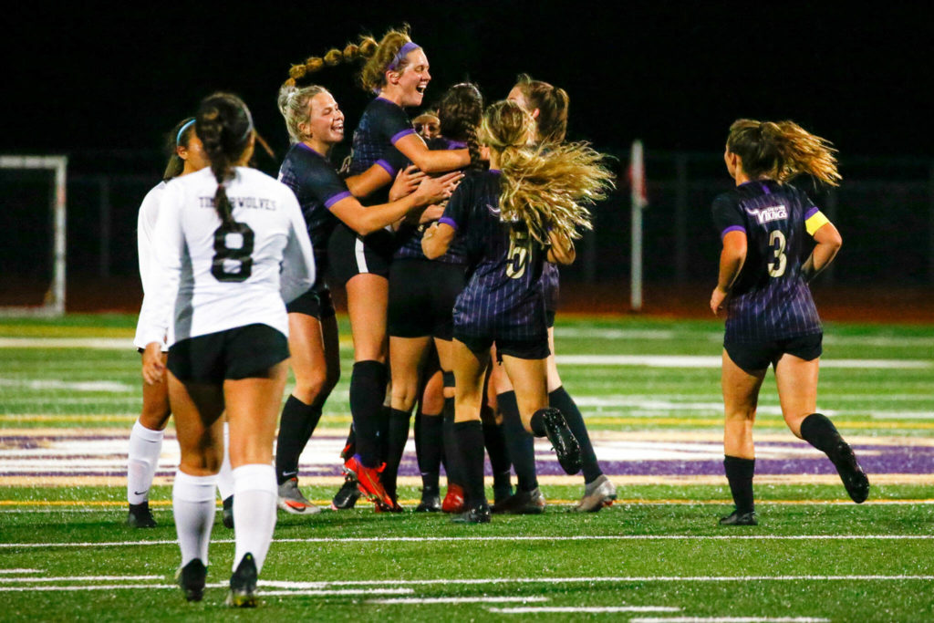 Lake Stevens soccer team celebrates a goal in the first half Tuesday night at Lake Stevens High School. (Kevin Clark / The Herald)
