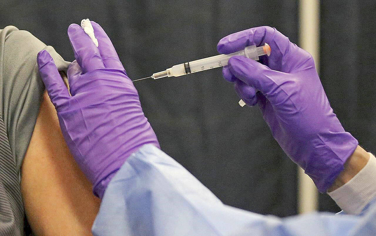 Experts are recommending COVID-19 vaccine boosters for all Americans, regardless of age, eight months after they received their second dose of the shot, to ensure lasting protection against the coronavirus. (Matt Stone / The Boston Herald)