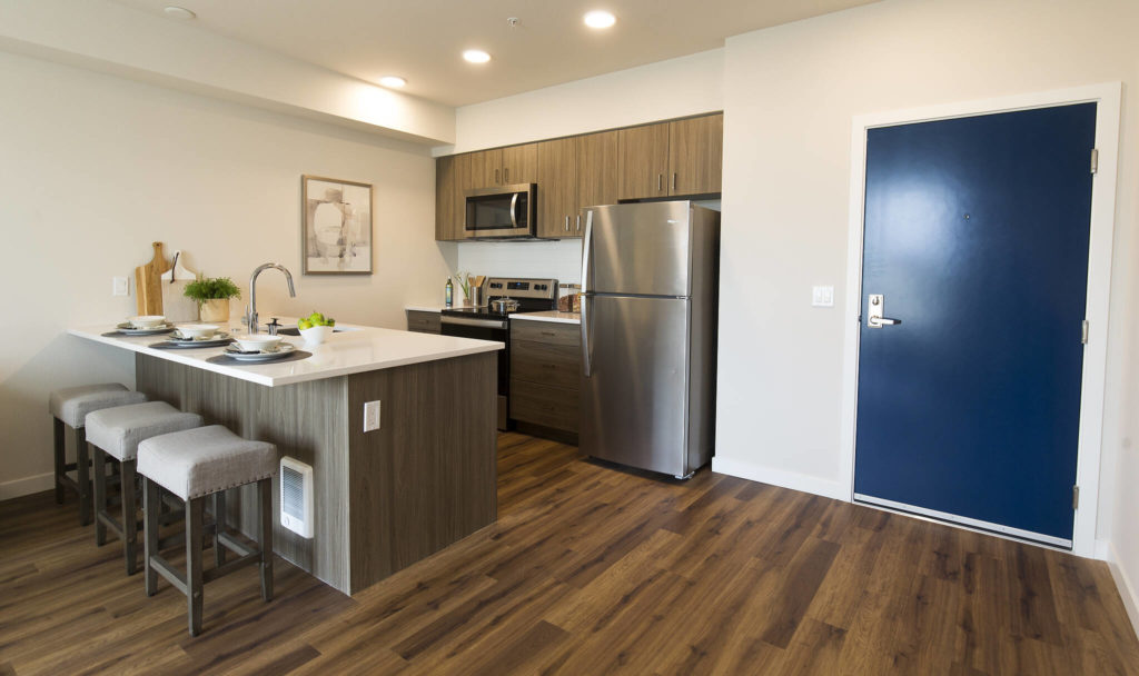 A kitchen in one of the 77 units of the Marquee Apartments in Everett. (Andy Bronson / The Herald) 
