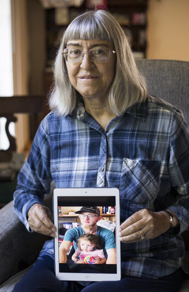 Deena Jones holds a photo of her nephew, William “Billy” Burnham, whose kidney she received on Sept. 12 after he was fatally stabbed in North Carolina. (Olivia Vanni / The Herald)
