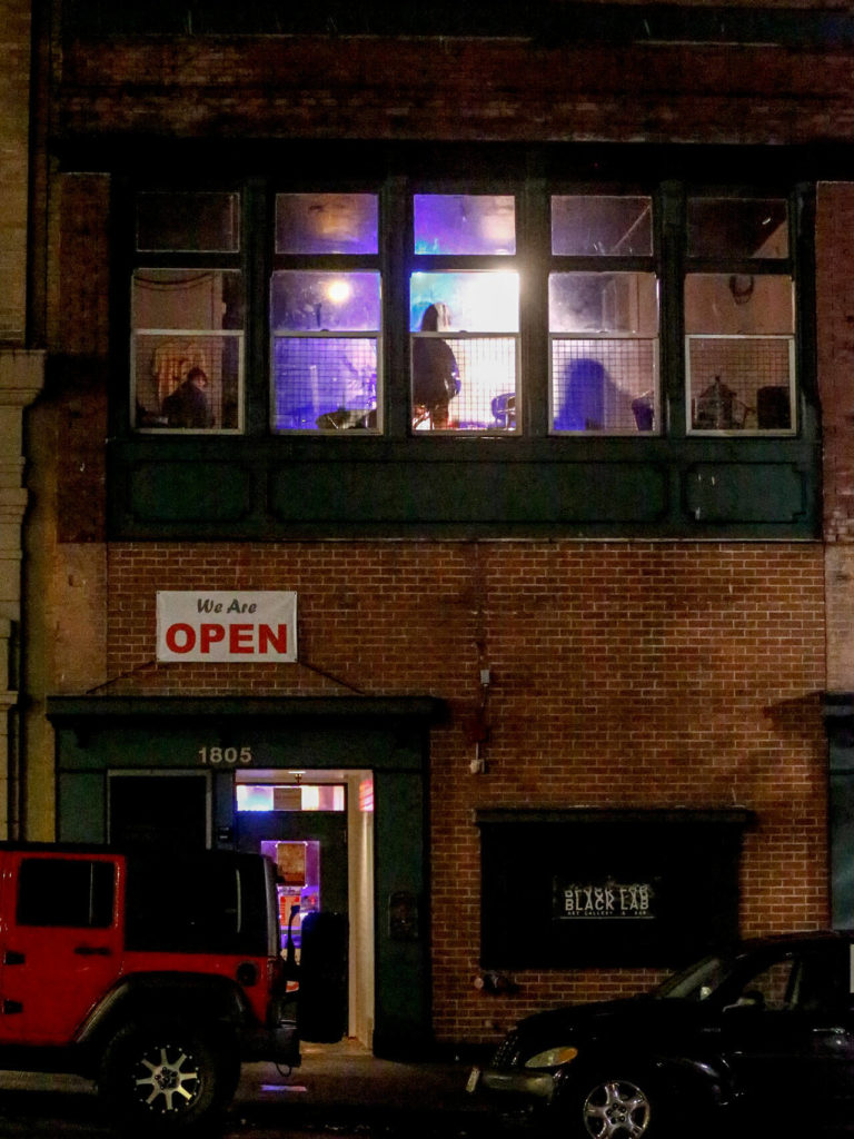 The scene through Black Lab Gallery’s front window at its new location in Everett. (Kevin Clark / The Herald)
