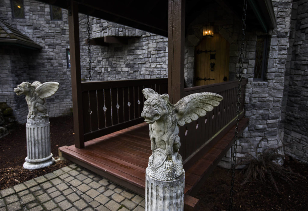 Gargoyles mark the entrance to the castle along with a wooden bridge that crosses a dry moat. (Olivia Vanni / The Herald)
