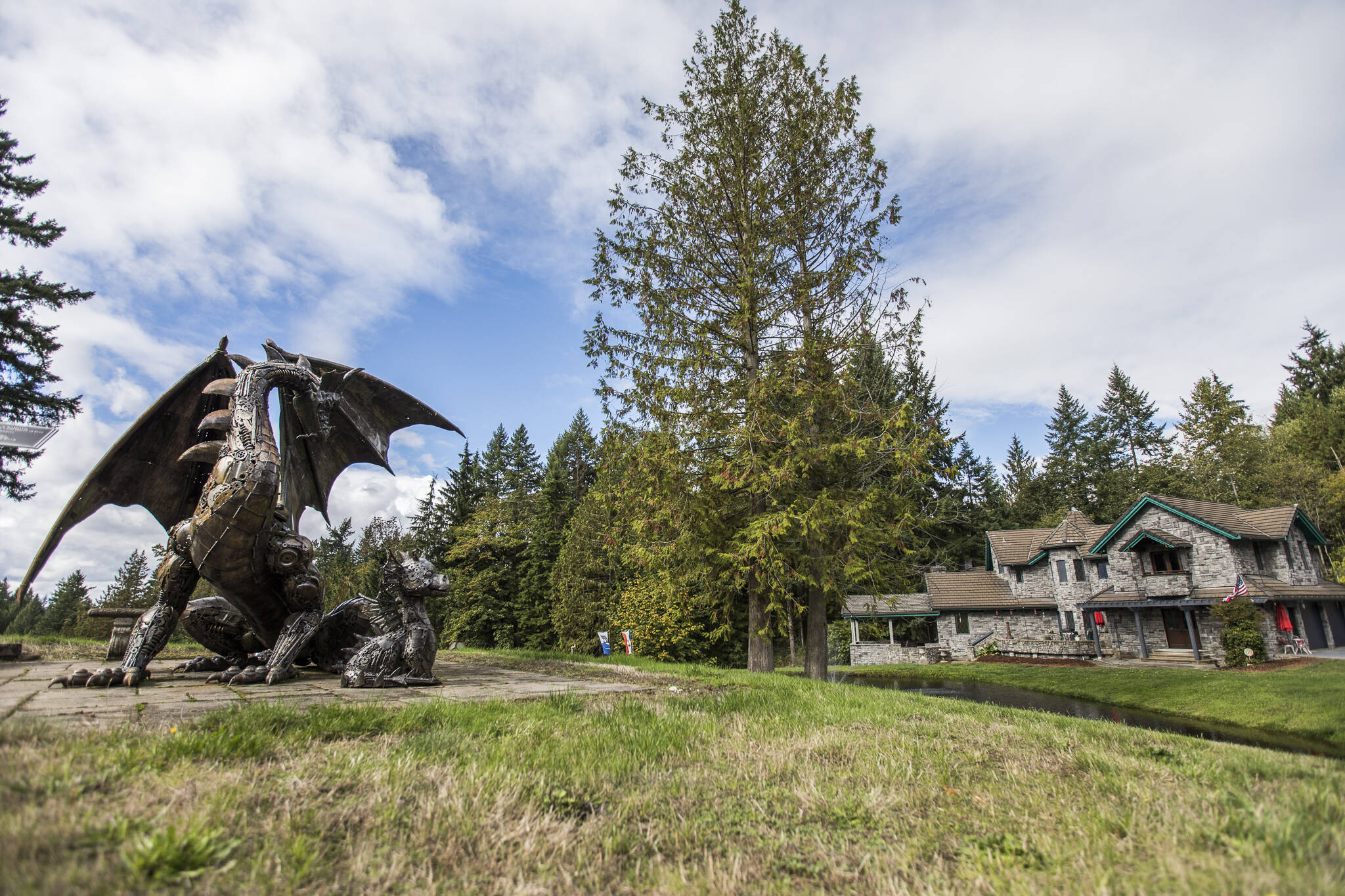 A dragon statue imported from Switzerland on display on the nearly 19-acre property. (Olivia Vanni / The Herald)