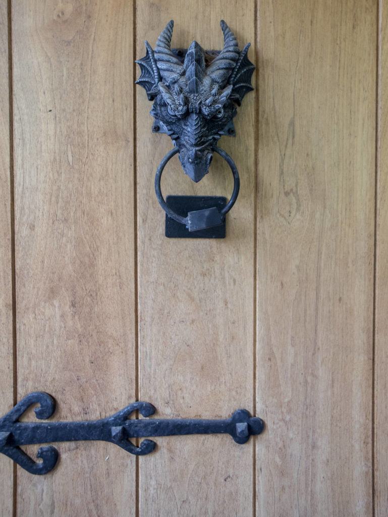 A dragon door knocker hangs from the front door. (Olivia Vanni / The Herald)
